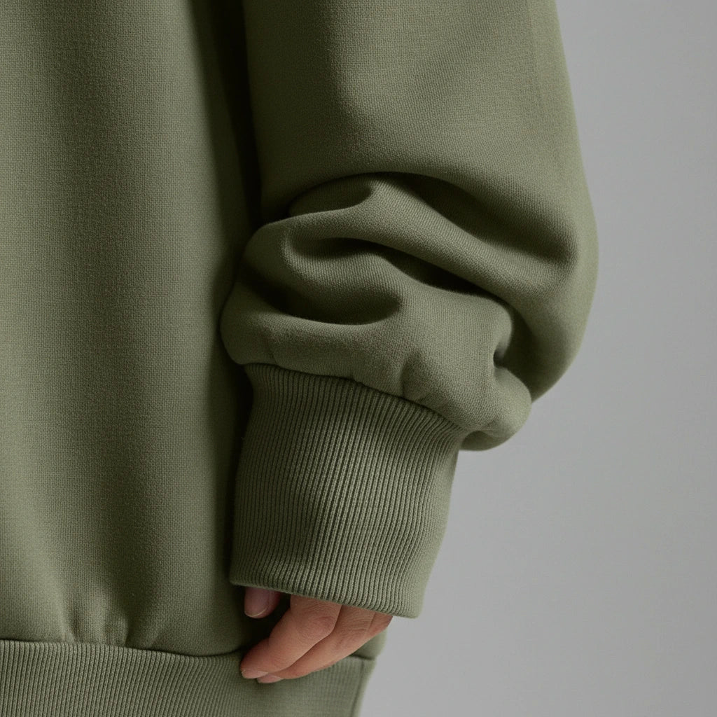 Close-up of the textured knit detail on the green Nora Oversized Textured Sweater
