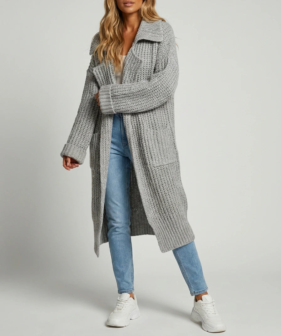 Phoebe Oversized Chunky Knit Lapel Longline Cardigan in grey, worn open/unbuttoned, side angle